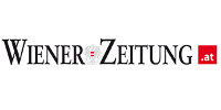 Schriftzug der Wiener Zeitung mit rotem AT-Symbol